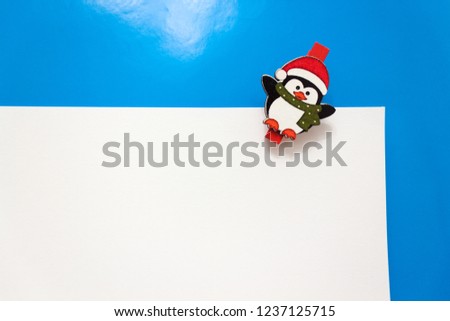 Set design template New Year's discount banner. Christmas poster with a cute penguin for sale. Happy holiday offer with penguin wearing a scarf and with cartoon gift. Xmas advertising for sale. 