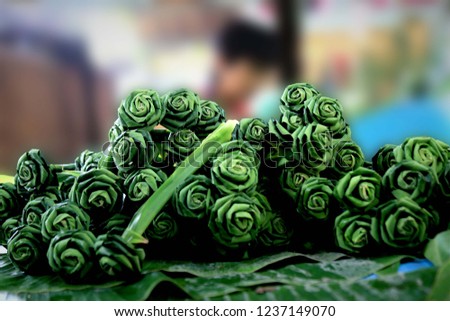 Close up of Roses Made by Pandan Leaves in meakhong market,with Khathong,flower made from pandan leaves,