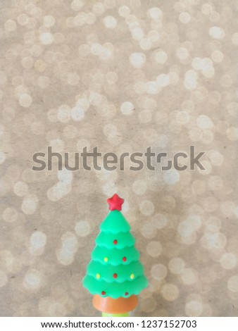 Ceramic tree of x-mas are placed with bokeh blurred background.out of focus and coppy space.