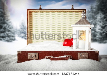 A winter suitcase full of snow in anticipation of Christmas 
