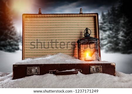 A winter suitcase full of snow in anticipation of Christmas 