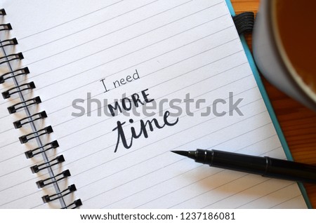 I NEED MORE TIME written in notebook Royalty-Free Stock Photo #1237186081