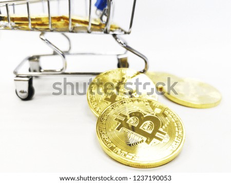 Selective focus Bitcoin in shopping cart with white background,Blockchain transfers shopping, Business bitcoin, Concept shopping unused money,Cryptocurrency,Currency