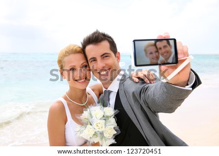 Bride and groom taking picture of themselves