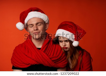 disappointed woman leaned her face on his shoulder a man in a sweater                 