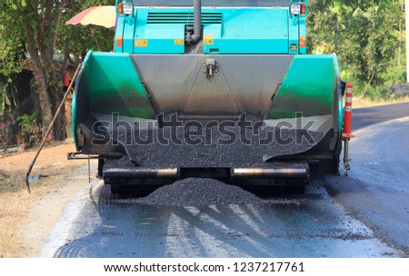 Machines are pouring asphalt on roads under construction and repair. And new construction makes traveling in the countryside of Thailand more comfortable.