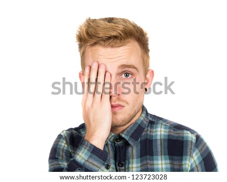Young handsome man isolated on white with one hand over an eye