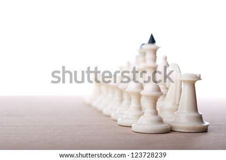 chess pieces isolated on wooden table