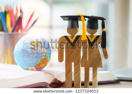 Australia Education knowledge learning study abroad international Ideas. People Sign wood with Graduation celebrating cap on open textbook with model global map, alternative studying world wide