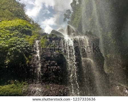 Close up a beautiful of waterfall in Indonesia. It is a beautiful picture.