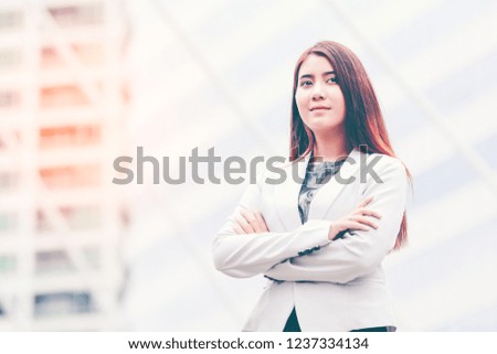 Portrait of Modern Young Happy Confident Successful Asian Beautiful Businesswoman,with copyspace. On city background , Business concept.