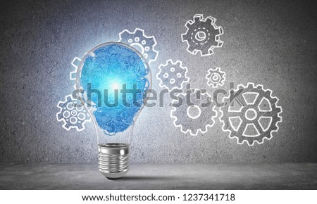 Shining lightbulb with multiple gears inside placed against sketched gear mechanism on grey wall on background. 3D rendering.