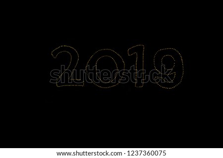 Write sentences with an animated Sparkler light alphabet  on black background. Happy New Year 2019