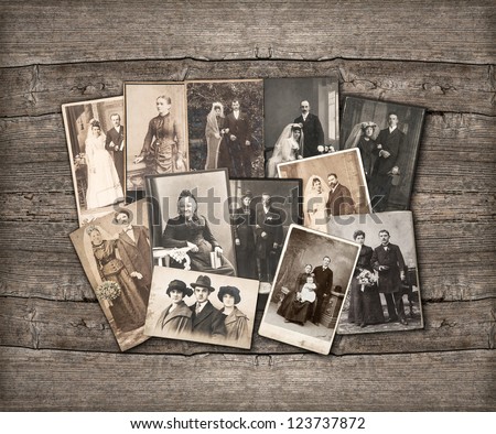 group of vintage family and wedding photos circa 1890-1920. nostalgic sentimental pictures on rustic wooden background