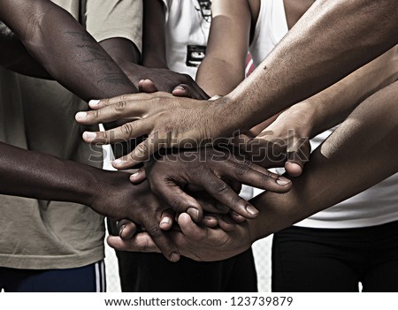 Closeup portrait of group with mixed race people with hands together Royalty-Free Stock Photo #123739879