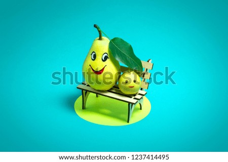 Fruits as people. Large and small pear like mother and child sit on bench. Light blue background