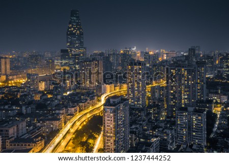Guangzhou night skyline. Financial concept.Cityscape before night, night lights and road traffic along the streets in financial district.