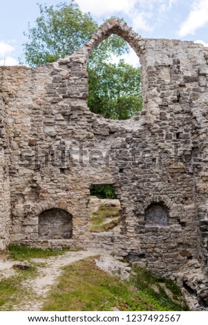 Ruined wall and arched window of the Koknese Castle - one of the largest and most significant medieval castles on Latvian territory. The castle  was built for the bishopric of Riga in 1209.