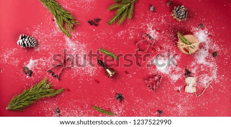 christmas red background with pine cone, bell, gift. 