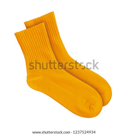 Orange socks on an isolated white background Royalty-Free Stock Photo #1237524934