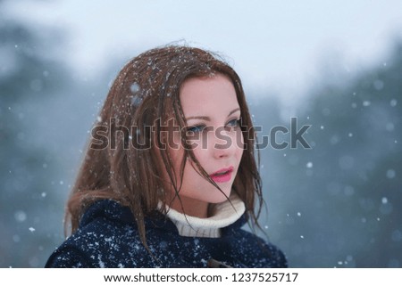 Christmas Winter.  Girl and snow. New Year and Xmas . Background. Falling  snowflakes. Dark forest, cold time.