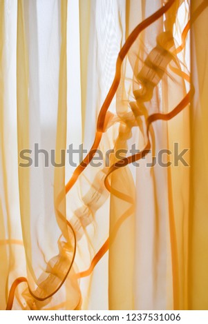 Yellow curtains close-up
