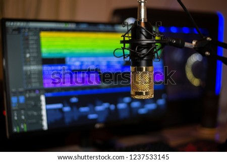 Golden microphone In recording room and computer for work, Recording studio.