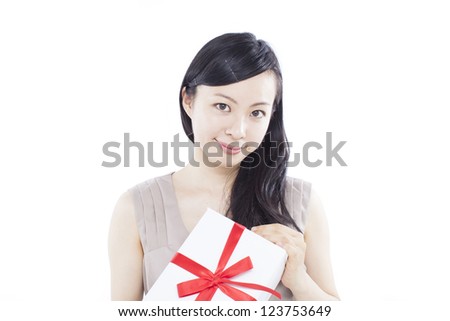 beautiful young woman with gift, isolated on white background