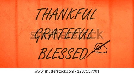 Thankful, Grateful, Blessed text symbol isolated on orange background. 