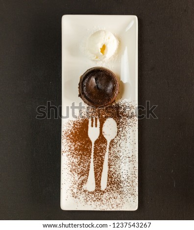 Chocolate fondant with ice creame black backgrounde