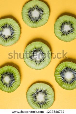Seamless kiwi pattern on yellow  background