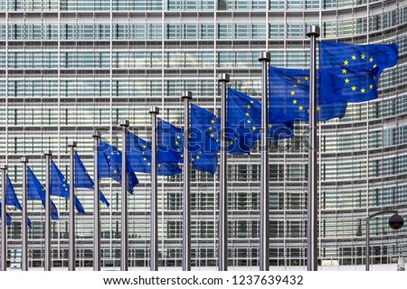 Row of EU Flags in front of the European Union Commission building in Brussels Royalty-Free Stock Photo #1237639432