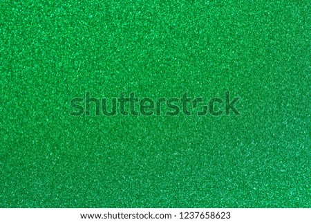 Color seafoam green shiny glitter Christmas texture background.
Gradient blue green light silver sparkle backdrop. 