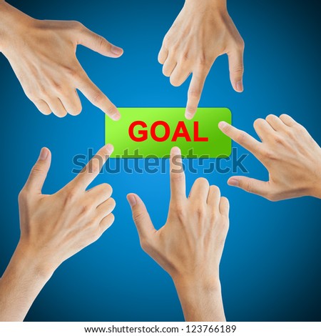 Goal button with real hand on blue background