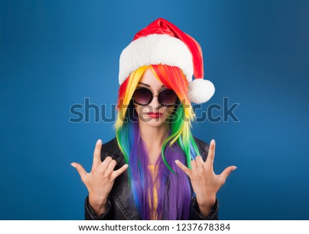 Beautiful model with a red santa hat on head