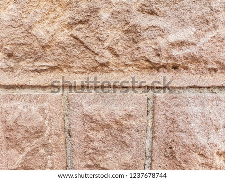 Carved stone on residentual house foundation close up shot on natural light.