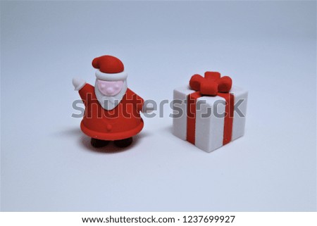 Merry Christmas and Happy New Year Santa Claus and gift box isolated