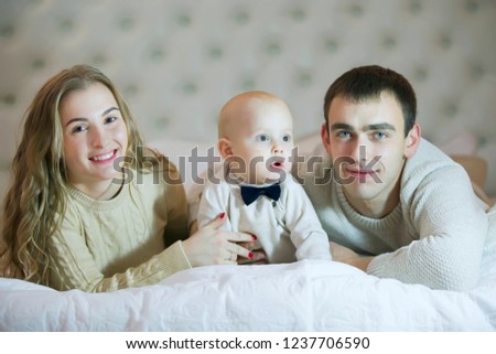 Mom dad and baby son. Parents and child. Portrait of a young family