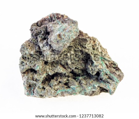macro photography of natural mineral from geological collection - rough malachite (copper ore) stone on white background