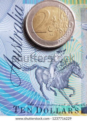 Close up of  australian banknote of ten dollars and coin of 2 euro, background and texture 