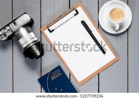 Camera on wooden background.