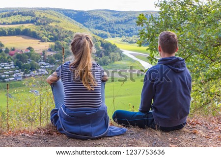 Mother and son viewing dry Edersee in german landscape