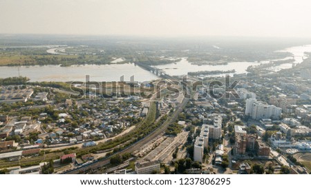 City panorama with railroads station, river and bridge, aerial photo