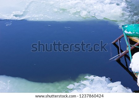 An ice hole in an open pond for the tempering of the body and religious rites for baptism and Epiphany (January 6, among Catholics, January 19, among Orthodox)