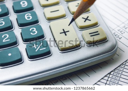 pencil with calculator on the table