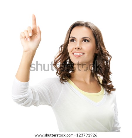 Happy smiling beautiful young woman showing blank signboard or copyspace, isolated over white background