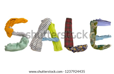 Word SALE made from different colorful cloth items on a white background. Isolated Royalty-Free Stock Photo #1237924435