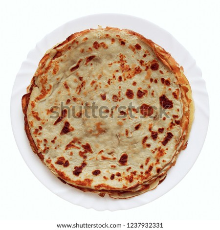 pancakes on a plate shot on an isolated white background