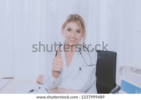 Doctors showing approval sign with thumb up. 