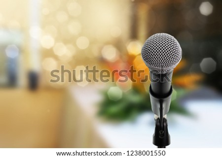 Microphone on boom stand ready for the meeting. Microphone on stage in conference hall.